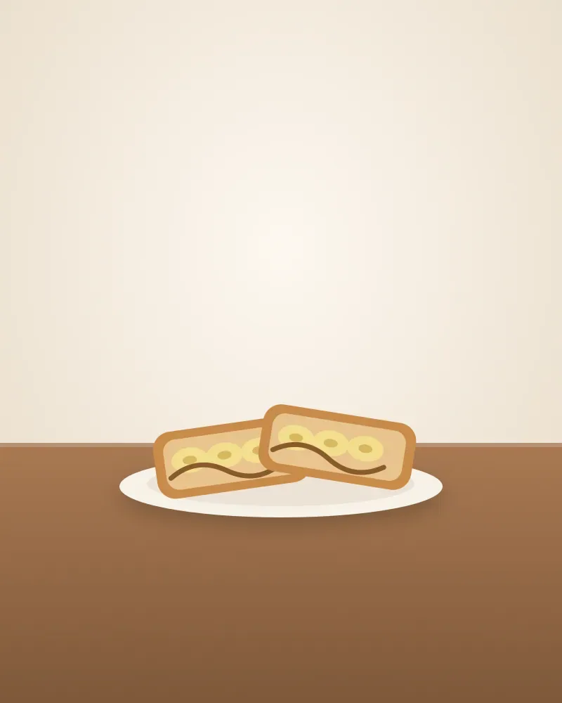 Dua potong roti bakar pisang di atas piring